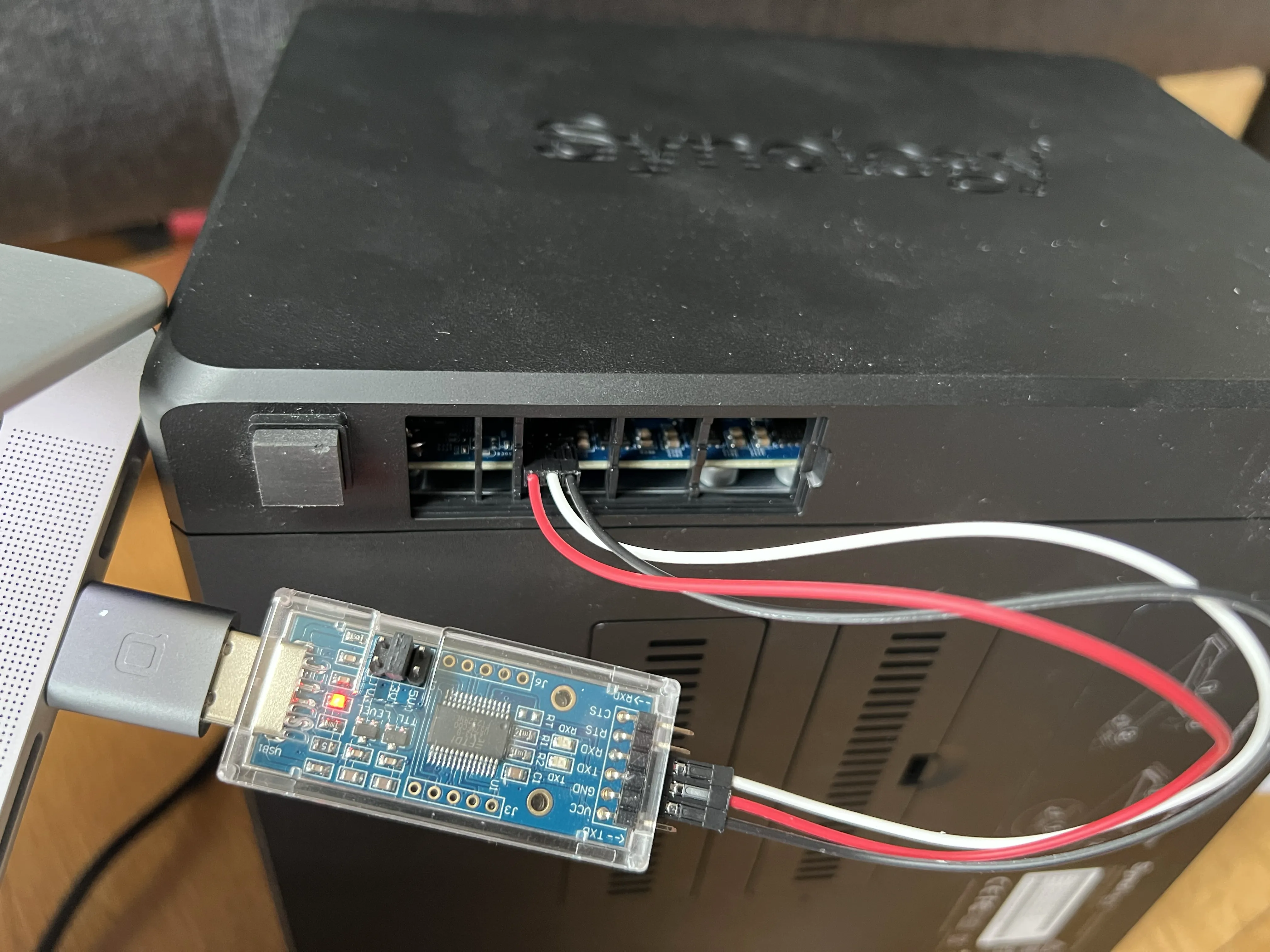 Figure 5. MacBook Connected to Synology NAS via USB-TTL Adapter for Debugging